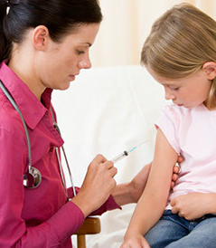 Image of a female physician doing a treatment by injecting a medical substance in a young girl's arm